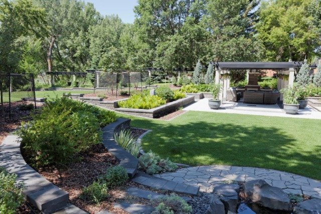 Garden vista with flagstone path and seating pergola