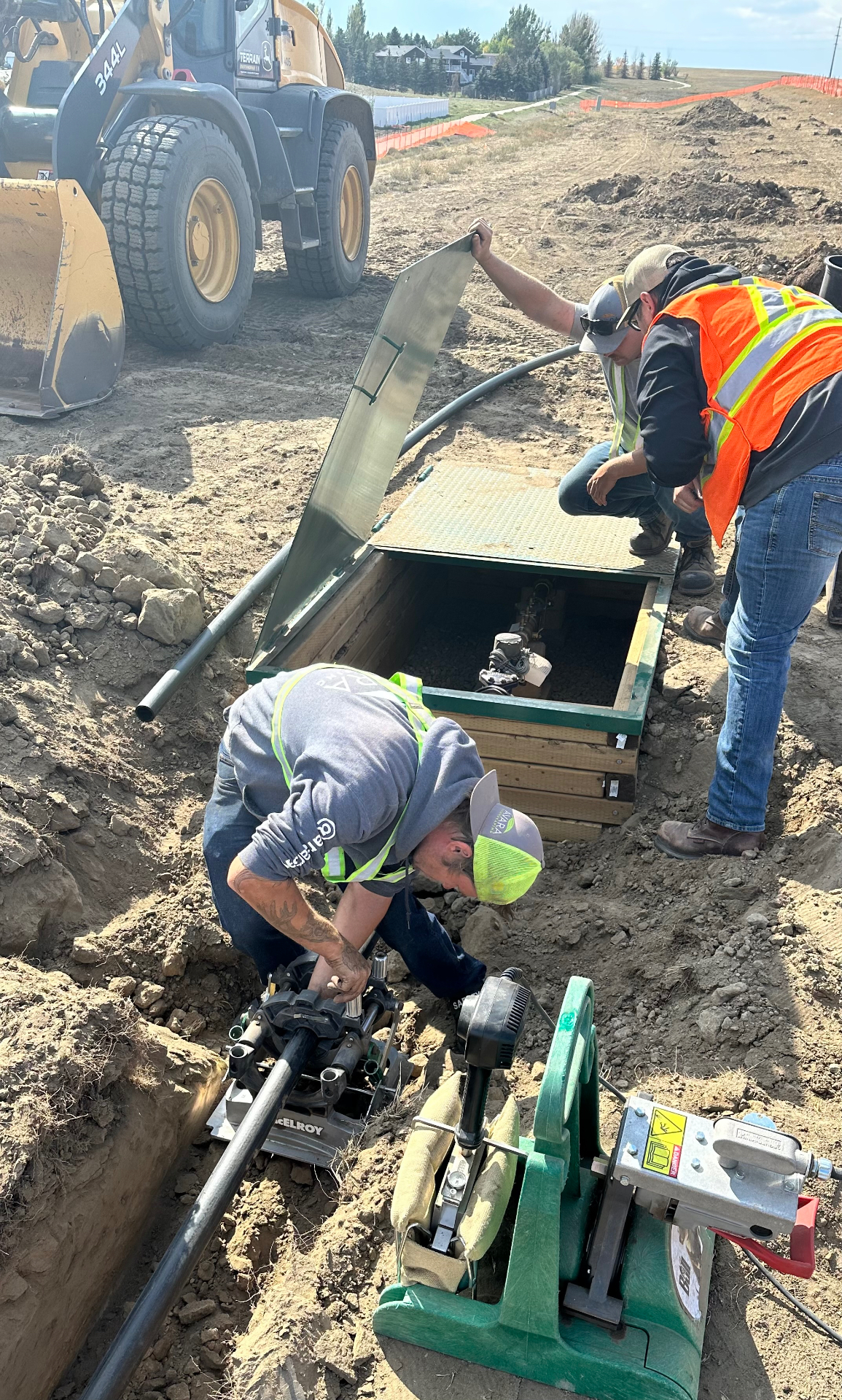 Dunmore Irrigation & Tree Project — Hot-tapped the municipal main, installed a new water meter, and fused 2,500 feet of HDPE mainline to feed irrigation for 171 Swedish Aspens and 58 Colorado Spruces across the development.